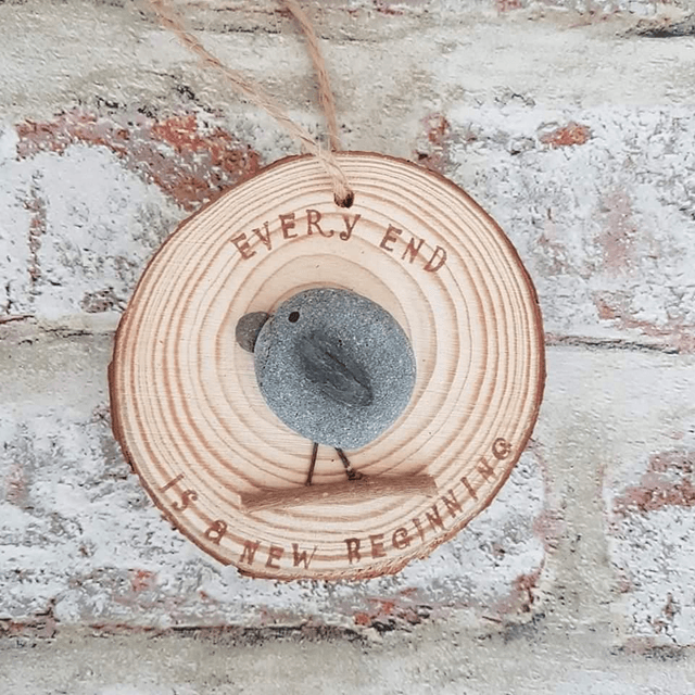Every end is a new beginning, pebble bird & logs slice